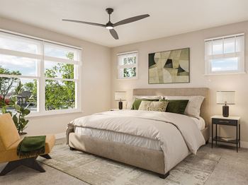 a bedroom with a large bed and a ceiling fan